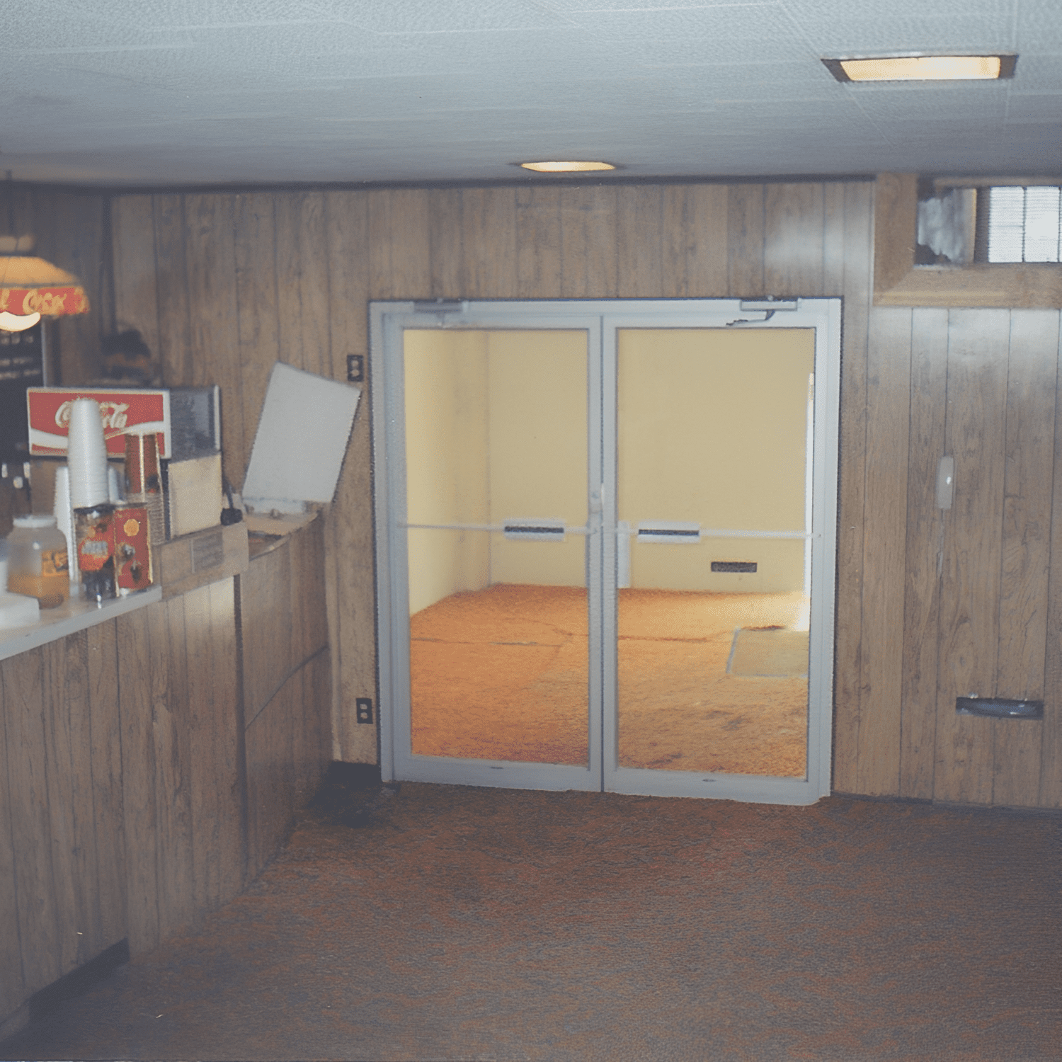 Basement with bar and small door.