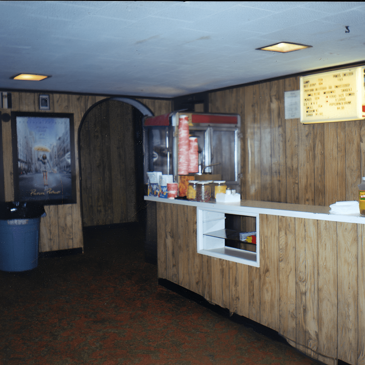 Vintage cinema concession stand with popcorn machine.