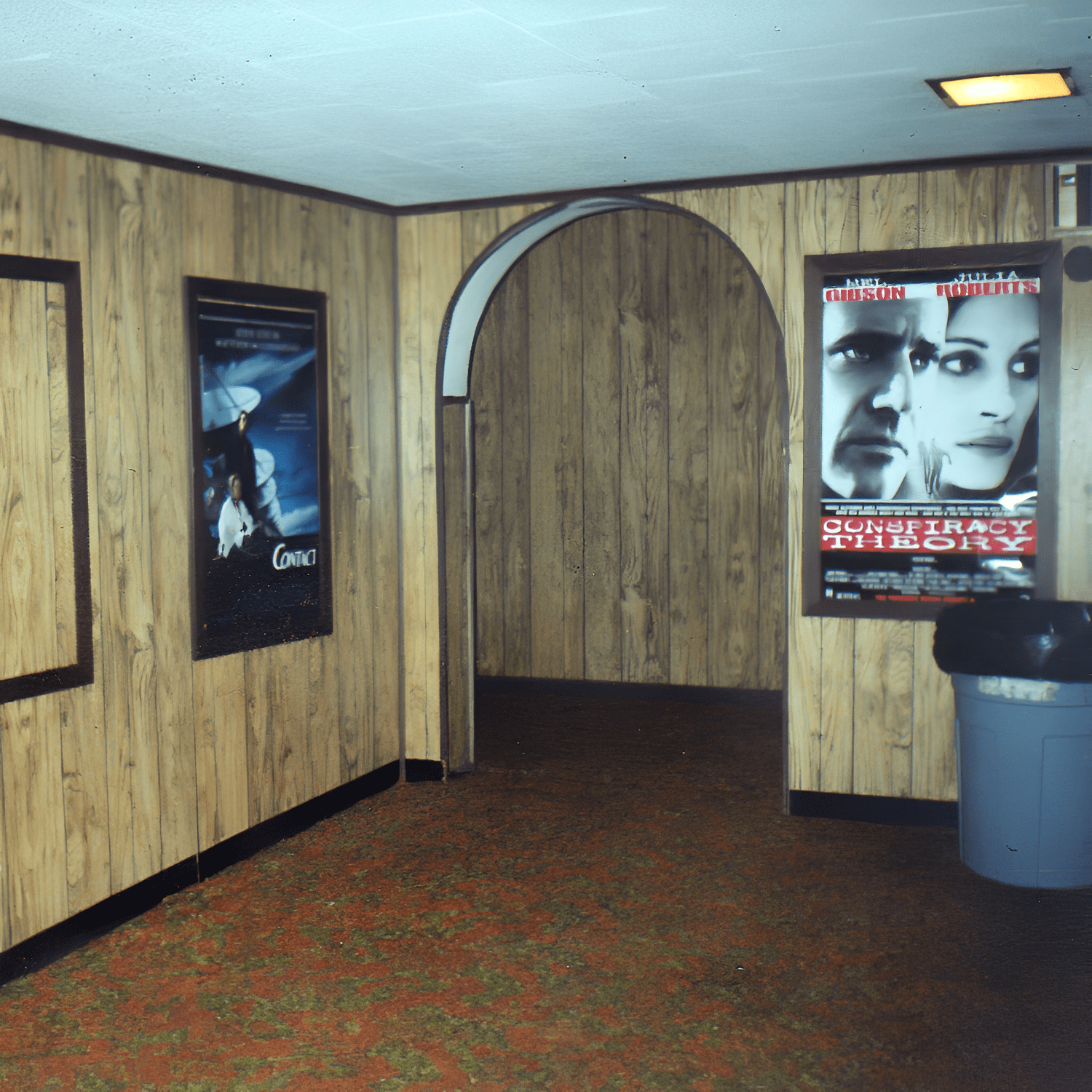 Wood-paneled hallway with movie posters displayed.